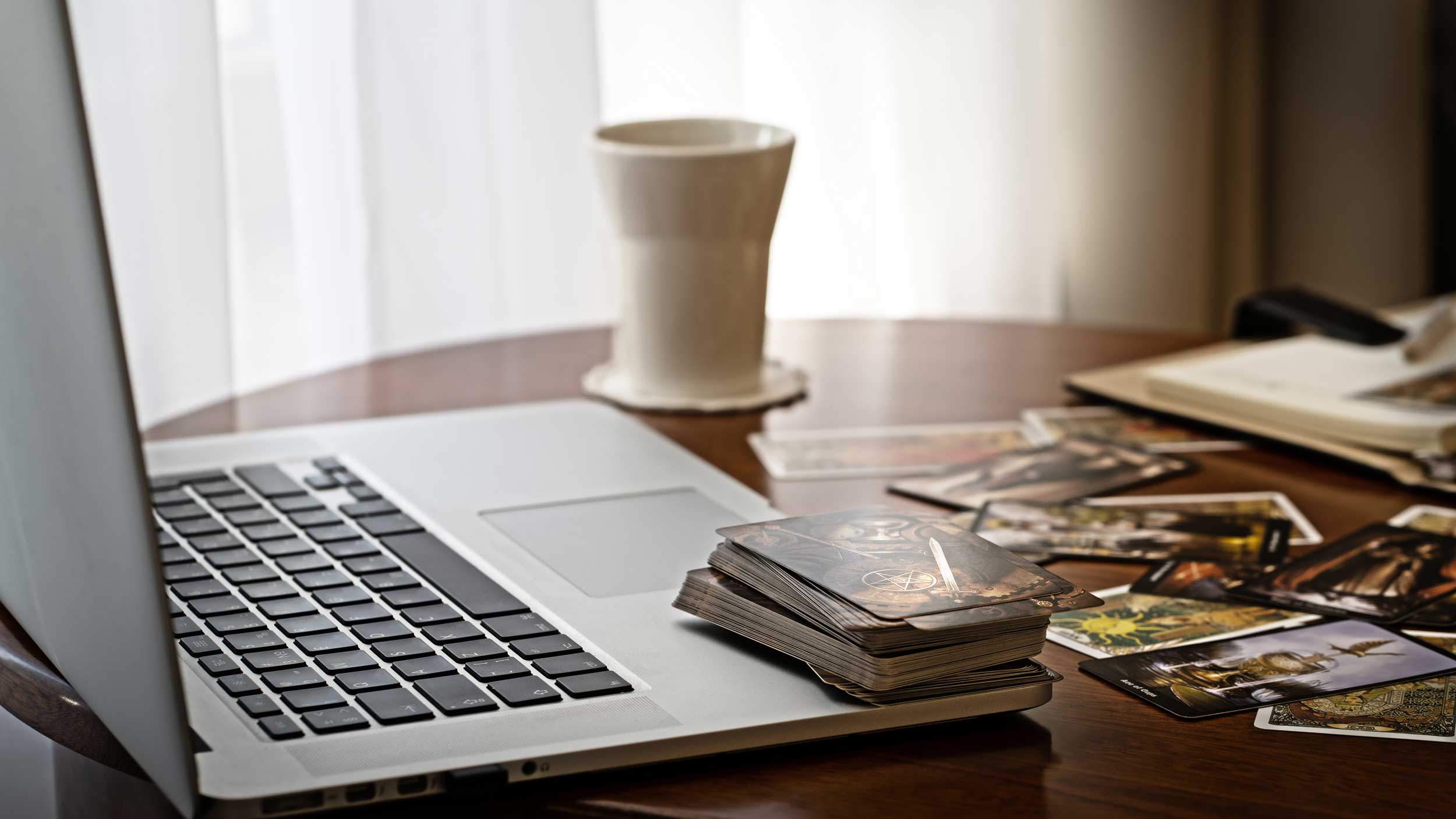 Laptop Computer, Tarot Cards and Cup